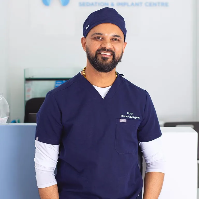 Dr Roshith Valiyamannil, implant dentist and oral surgeon, in a professional portrait